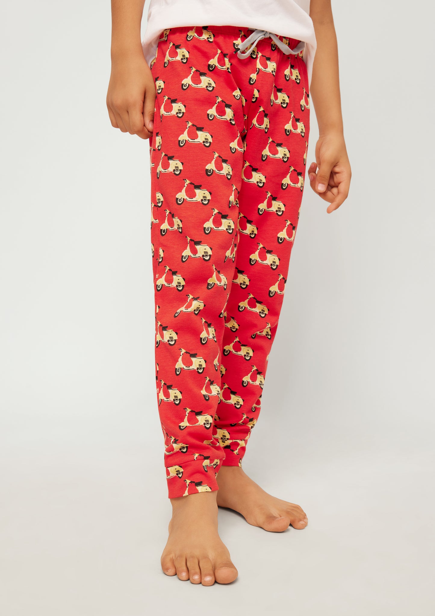 RED, YELLOW AND BLACK SCOOTER PRINT KNITTED PANTS
